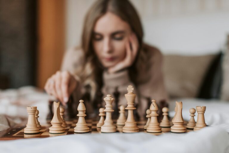 an woman playing chess